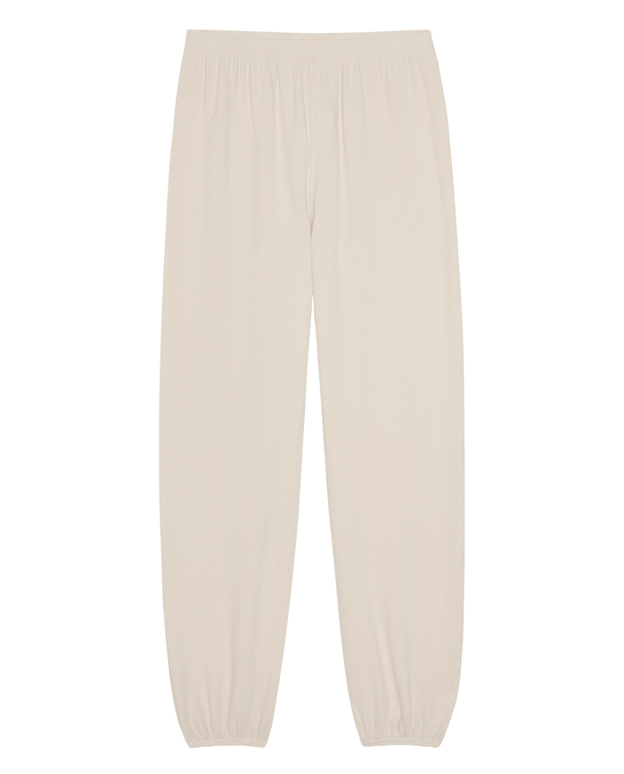 Washed white, full-length The Dance Pant by THE GREAT., featuring an elastic waistband and elasticated cuffs, laid flat on a white background.