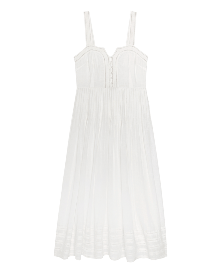 The Day Break Dress by THE GREAT. SU26 is a sleeveless white sundress featuring a fitted bodice, button front detail, and a gathered, flowy skirt.