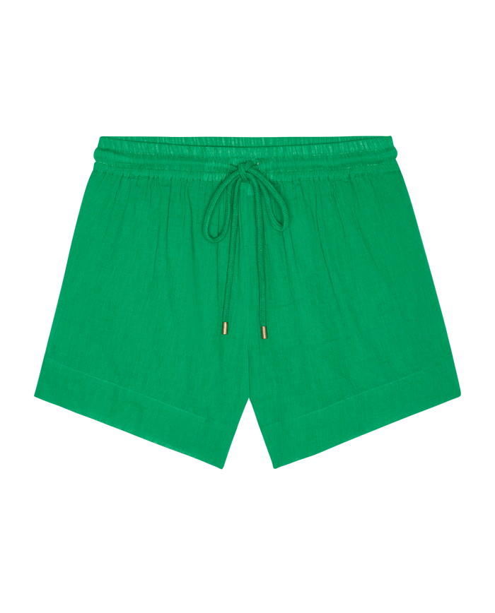 The Delta Short – Bright Sprig by THE GREAT. SP26 SWIM features green linen, an elastic waistband, and a drawstring tie for casual comfort and men's athletic style, shown on a white background.