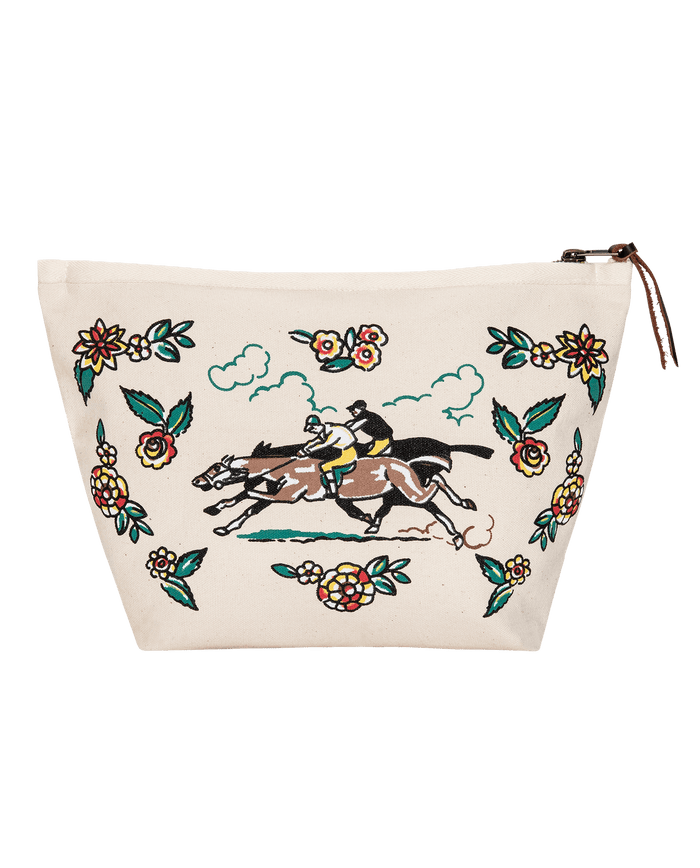 The Derby Pouch in cream by THE GREAT. PF26 features embroidered horse riders racing, accented with vibrant floral patterns.