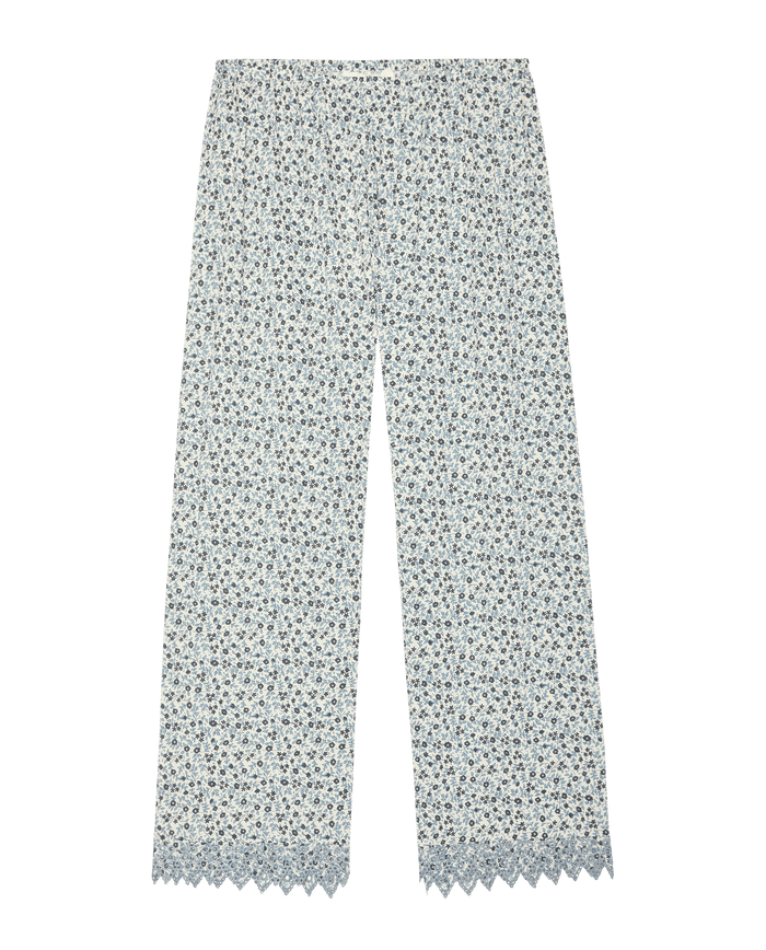 The Great. SP26 Sleep Eyelet Easy Sleep Pant—Bluebell Ditsy: light blue and white floral cotton voile pajama pants with wide legs, lace-trimmed hem, and embroidered eyelet details, shown on a white background.