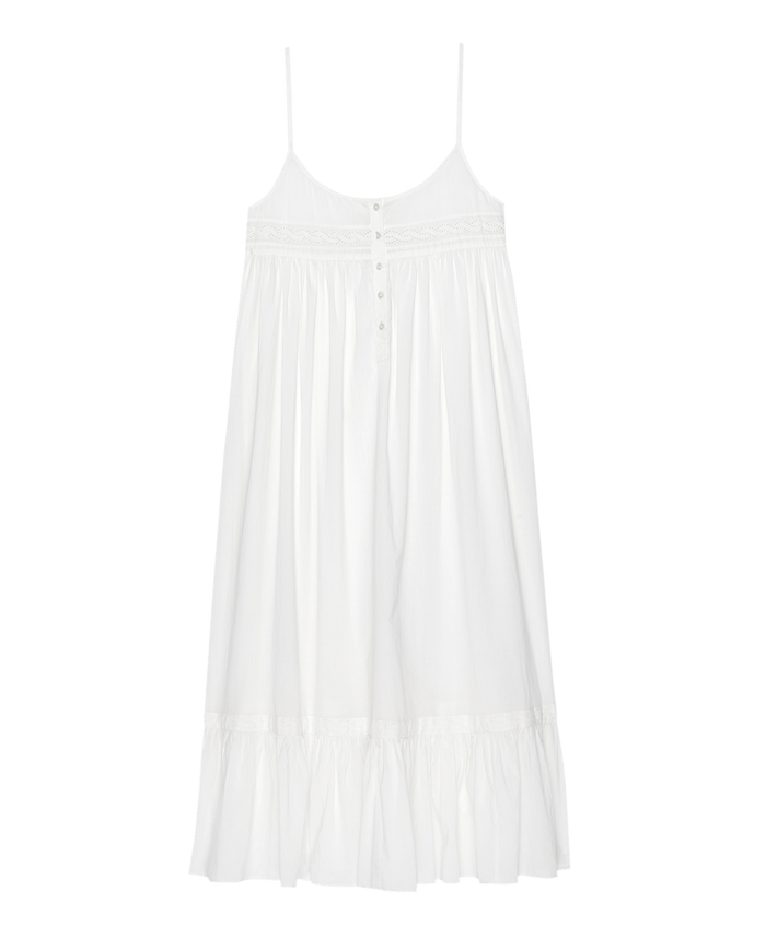 The Eyelet Ruffle Tank Night Dress by THE GREAT. PS25 SLEEP is a true white sleeveless piece with spaghetti straps, front buttons, Victorian-inspired eyelet lace trim, and cotton voile fabric. The relaxed design features a ruffled hem for an airy finish.