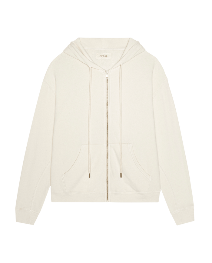 Introducing The Fleece Campus Hoodie in Washed White by THE GREAT. F26 D1 FLEECE BACK KNITS—a soft fleece cotton-blend hoodie featuring a drawstring hood, front pockets, and long sleeves, shown laid flat against a white background.