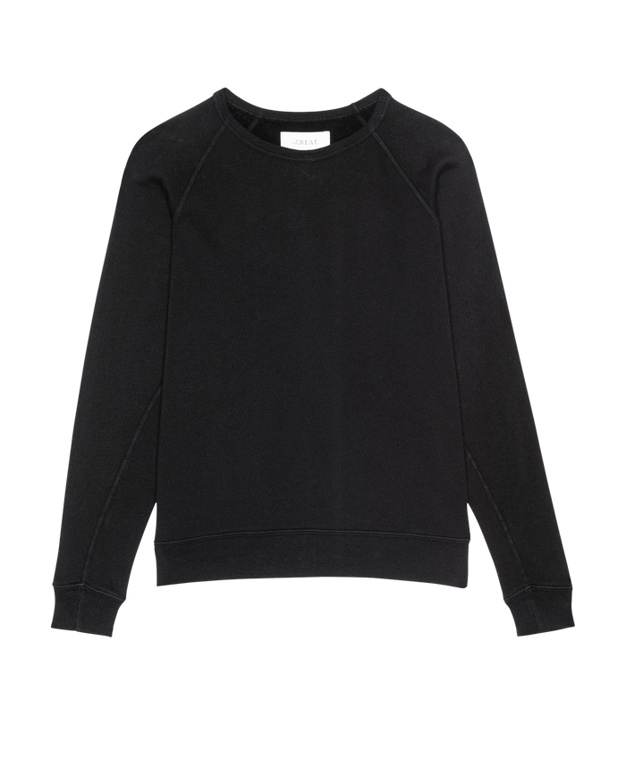 The Fleece Rookie Sweatshirt by THE GREAT. H25 CORE FLEECEBACK in Almost Black, featuring long sleeves and a crewneck, is laid flat on a white background.