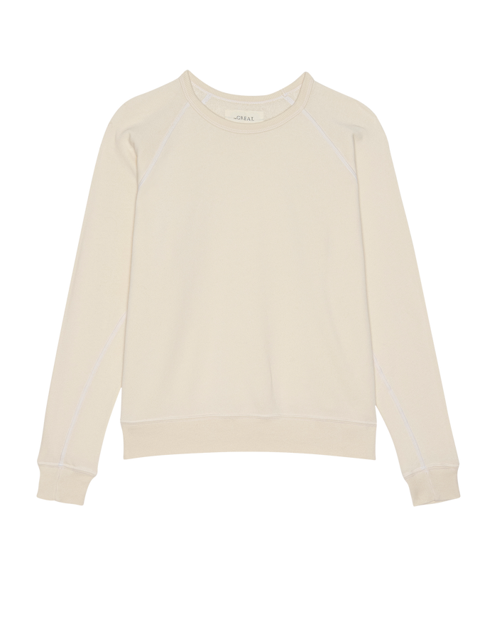 THE GREAT. H25 CORE FLEECEBACK: The Fleece Rookie Sweatshirt in Washed White—a long-sleeve, crewneck classic shown flat on a white background.