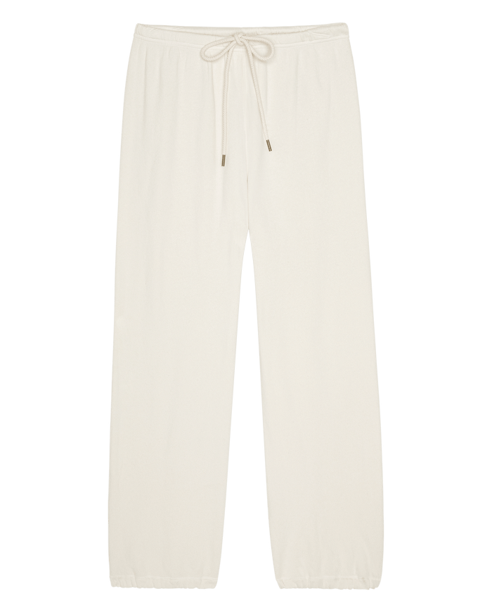 The Fleece Sport Sweatpant in Washed White by THE GREAT. is shown laid flat on a white background, featuring an elastic waistband with a drawstring tie, straight legs, and elasticized cuffs.