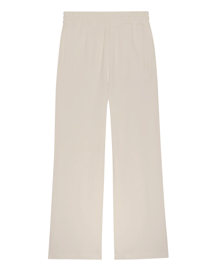 The Fleece Victory Sweatpant by THE GREAT. H25 CORE FLEECEBACK in washed white features a wide-leg design, elastic waistband, and side pockets, shown laid flat on a white background.