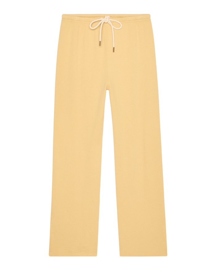 The Lap Sweatpant in Butter Yellow by THE GREAT. SP26 SEASONAL CORE features a straight-leg fit, elastic waistband, and white drawstring. Handcrafted in Los Angeles, shown on a plain white background.