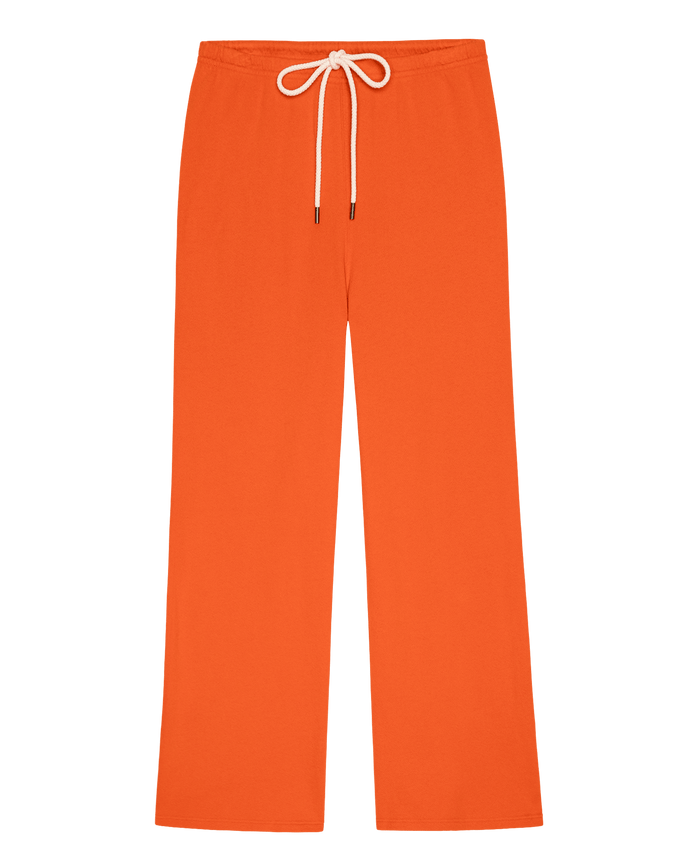 The Lap Sweatpant in Persimmon by THE GREAT. SP26 SEASONAL CORE—wide-leg with elastic waistband and white drawstring, handcrafted Los Angeles style, shown laid flat on a white background.