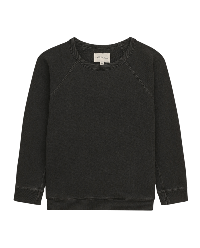 The Little College Sweatshirt by THE GREAT. HOL 21 LITTLE is a washed black long-sleeve vintage piece with visible seams, a small size tag at the neck, crafted from double-washed terry for extra comfort.