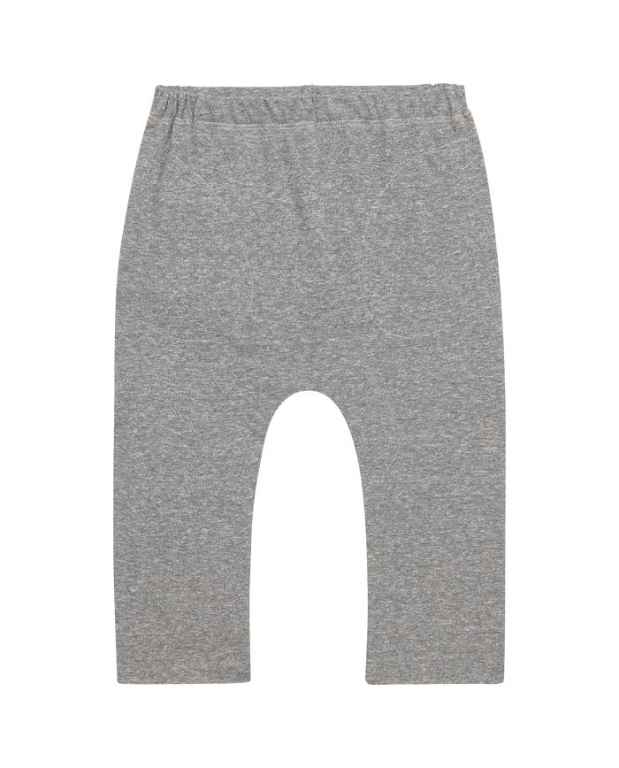Heather Grey "The Little Jersey Crop" by THE GREAT. FALL 22 LITTLE consists of gray, cotton baby pants featuring an elastic waist and a simple design reminiscent of the jersey crop style, presented against a sleek black background.