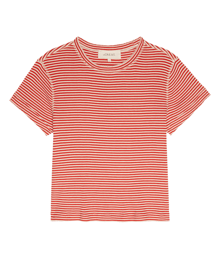 The Little Tee by THE GREAT. SU26 in Pimento Stripe is a short-sleeved, red and white striped top with a round neckline and slightly cropped hem, shown laid flat.