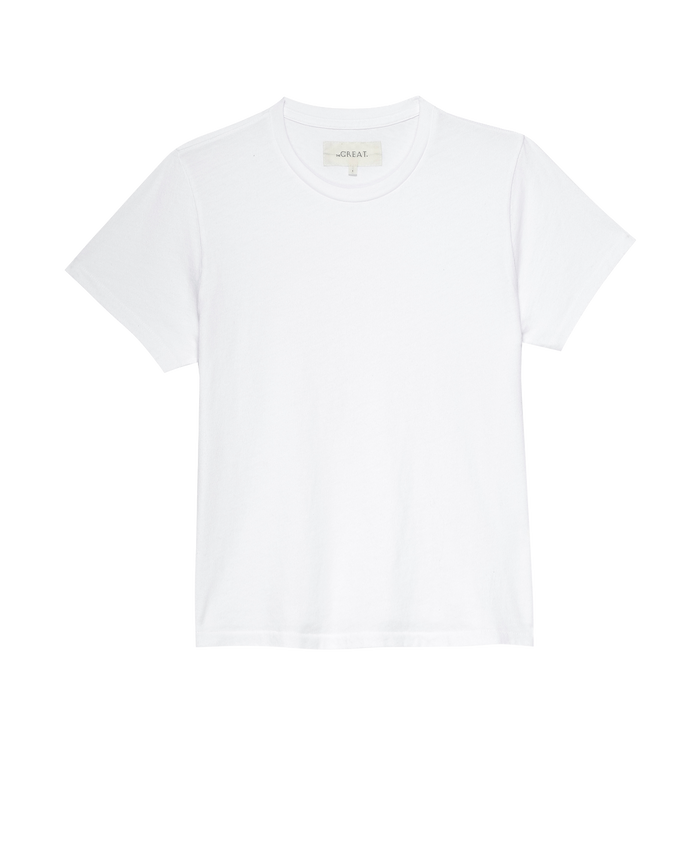 The Little Tee. Solid -- True White by THE GREAT. SP22 APRILCAP is a plain white short-sleeve crew neck t-shirt, made in the USA and displayed against a white background.