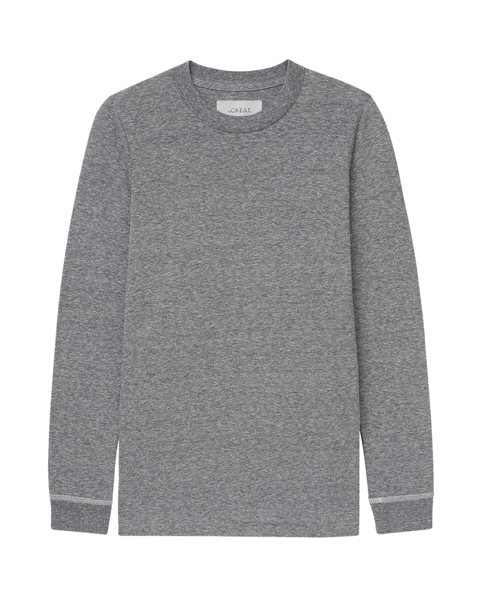 The Long Sleeve Slim Tee in Heather Grey by THE GREAT. F25 CORE KNITS is shown laid flat on a white background, making it a versatile layering essential.