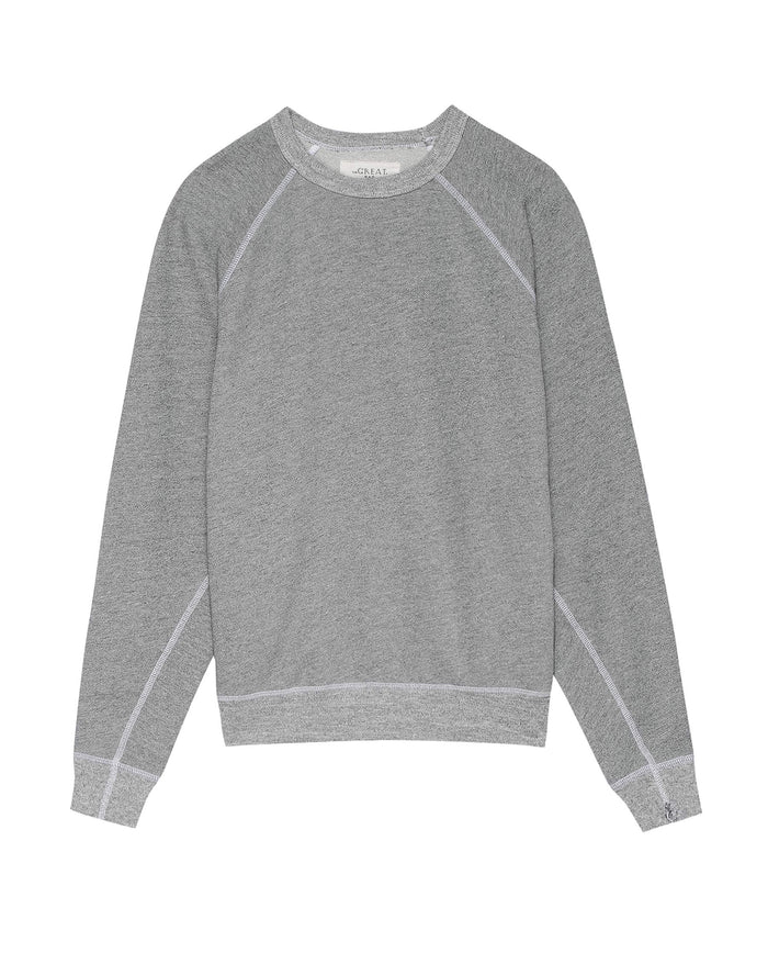 The Men's College Sweatshirt in Varsity Grey by THE GREAT. MAN combines a vintage-inspired design with ultimate comfort, featuring a crew neckline, long sleeves, and white stitching.