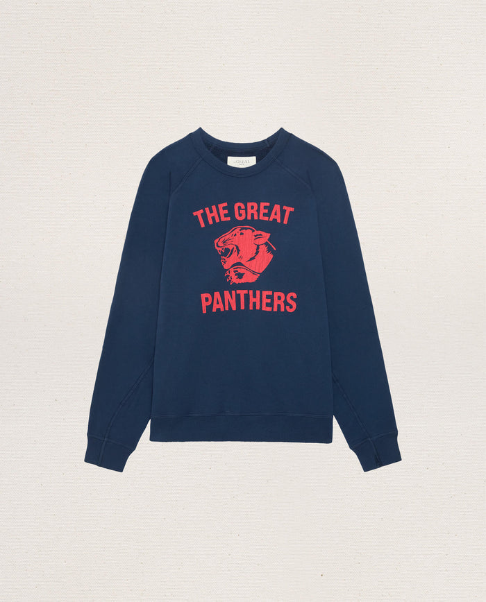 True Navy “The Mens College Sweatshirt w/ Growling Panther Graphic” by THE GREAT. F26 D1, featuring bold red “THE GREAT PANTHERS” text and a striking red panther graphic on the front. Crafted from soft French Terry and displayed flat against a neutral background.