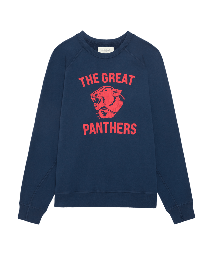 The Mens College Sweatshirt w/ Growling Panther Graphic by THE GREAT. F26 D1 features a true navy fleece-back French terry fabric and showcases bold red “THE GREAT PANTHERS” text with a striking red growling panther head graphic on the front, capturing the vintage style of classic collegiate sweatshirts.