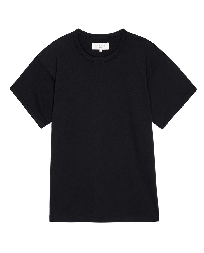 A plain black, heavyweight fabric t-shirt from THE GREAT. FALL 23 MEN's collection, The Men's Pure Knits Boxy Crew in Solid Almost Black, with a classic crew neck and short sleeves, laid flat against a white background.