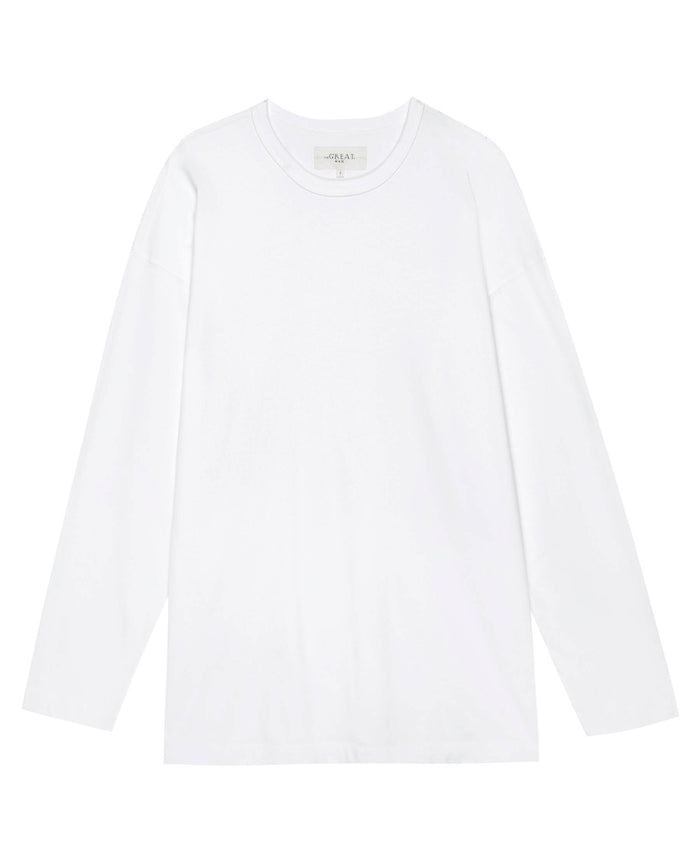 The Men's Pure Knits Long Sleeve Boxy Crew in True White from THE GREAT. FALL 23 MEN is laid flat against a white background. The garment's heavy weight fabric and boxy shape give it a simple yet refined casual look.