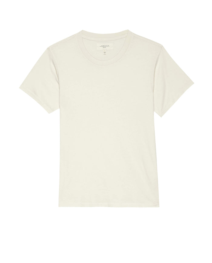A washed white Men's Slim Tee from THE GREAT. HOL 21 MENS, featuring a crew neckline and displayed against a white background. This vintage-inspired T-shirt is made in the USA.