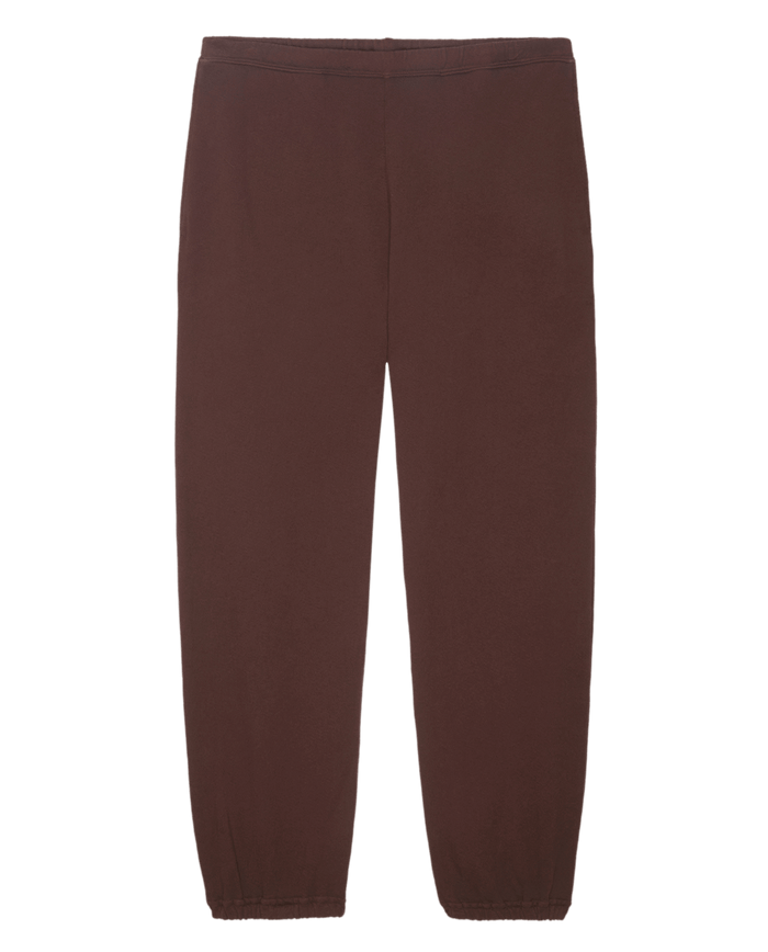 The Men's Stadium Sweatpant in Toasted Walnut by THE GREAT. FALL 24 MEN, showcasing an elastic waistband and elasticized cuffs at the ankles, reminiscent of vintage athletic wear, displayed on a plain white background.