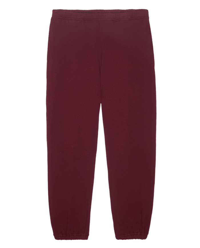 The Men's Stadium Sweatpant in solid plum from THE GREAT. HOL 24 MEN features an elastic waistband and cuffs, set against a clean white background. Combining style and comfort, these activewear essentials for men are perfect for casual outings or workout sessions.