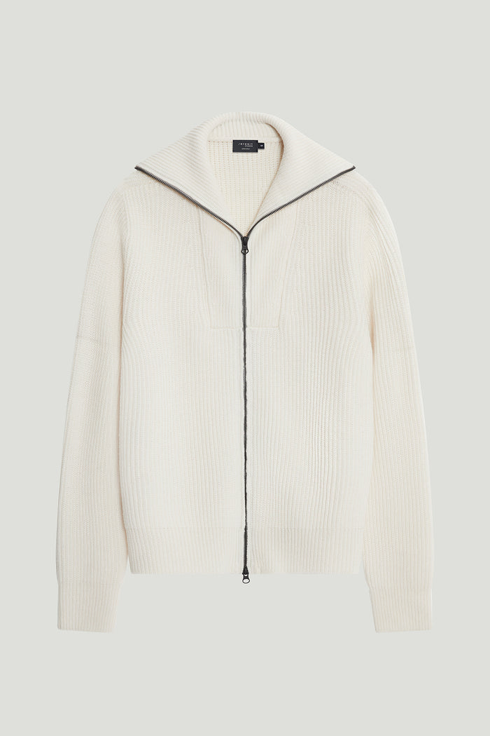 White ribbed sweater with a zipper on a light gray background