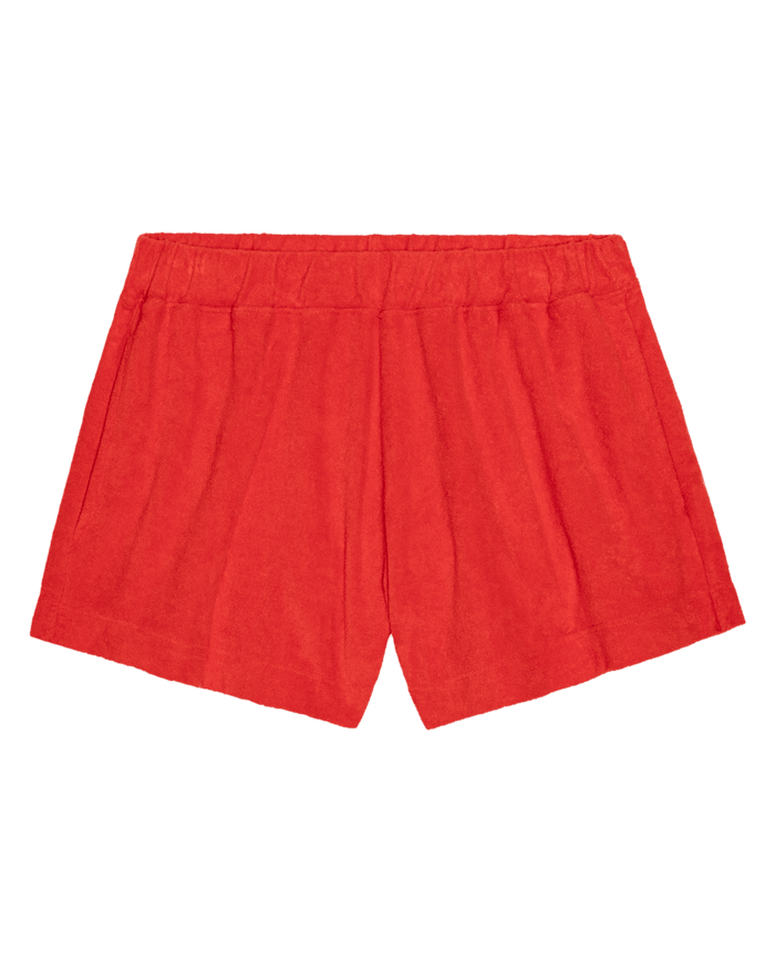 The GREAT. SU26 The Micro Terry Swing Short in Pimento, featuring an elastic waistband, shown on a plain white background.
