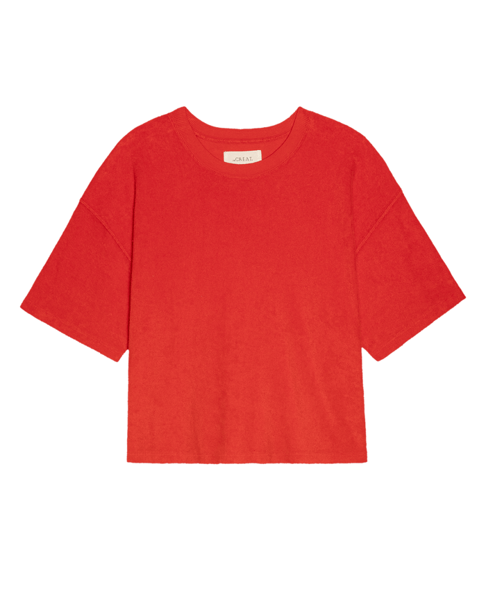 The Micro Terry Track Crew in Pimento by THE GREAT. SU26—a soft micro terry, plain red crew neck short-sleeve tee—displayed on a white background.
