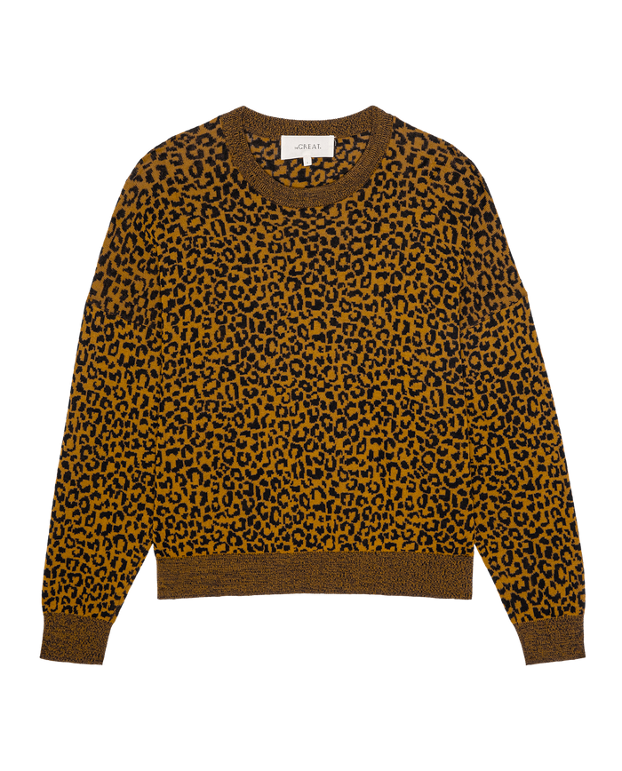 THE GREAT. SP26 D1 The Oversized Pullover – Leopard: women’s brown and black leopard print sweater with long sleeves, ribbed cuffs, collar, and hem, shown laid flat on a white background.