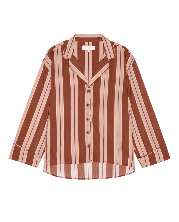 THE GREAT. F26 SLEEP “The Pajama Shirt.” in Ganache Stripe features brown and pink vertical stripes, a collared neckline, and long sleeves, shown on a white background.