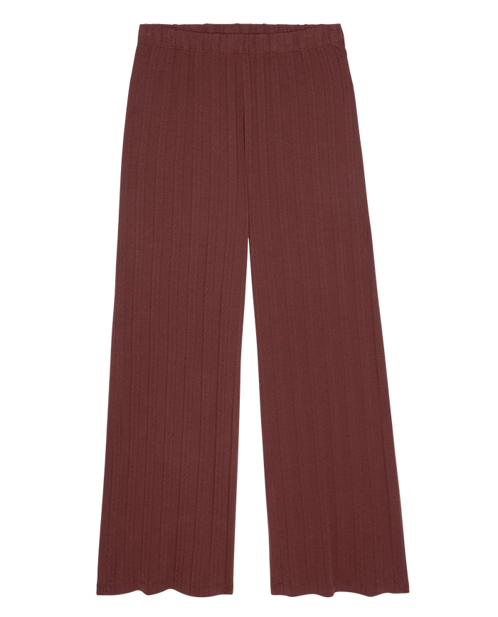 The Wide Leg Sleep Pant in maroon by THE GREAT. F26 SLEEP, featuring a ribbed high-waisted design and wide-leg silhouette, is shown laid flat on a white background.