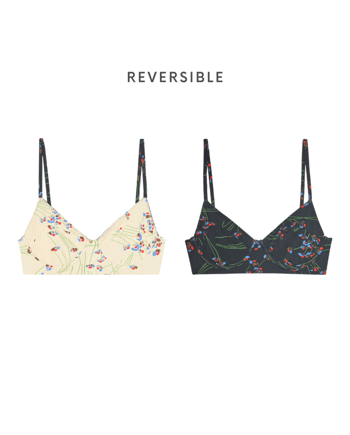 THE GREAT. SP26 SWIM's Reversible Underwire Bikini Top in Windblown Bouquet features thin straps and two floral sides—one light, one dark—inspired by the charm of 1940s vintage bikini swimwear.