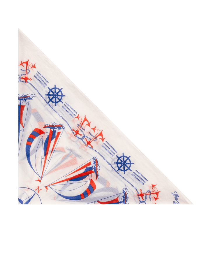 The Sailboat Bandana - White by THE GREAT. SU26: A white triangular bandana with blue and red ship wheels, anchors, and sailboats on a plain background. Ideal sailboat accessory for a maritime-inspired style.