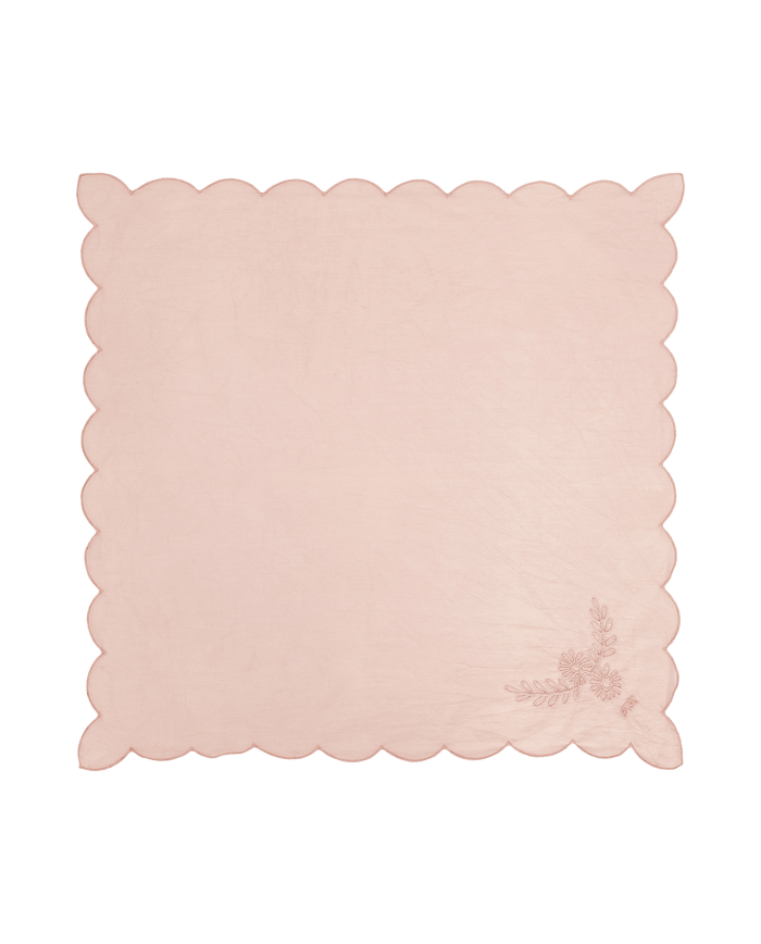 The Scalloped Bandana -- Petal by THE GREAT. SU26 features a light pink hue, scalloped edges, and delicate floral embroidery in one corner, shown on a white background.
