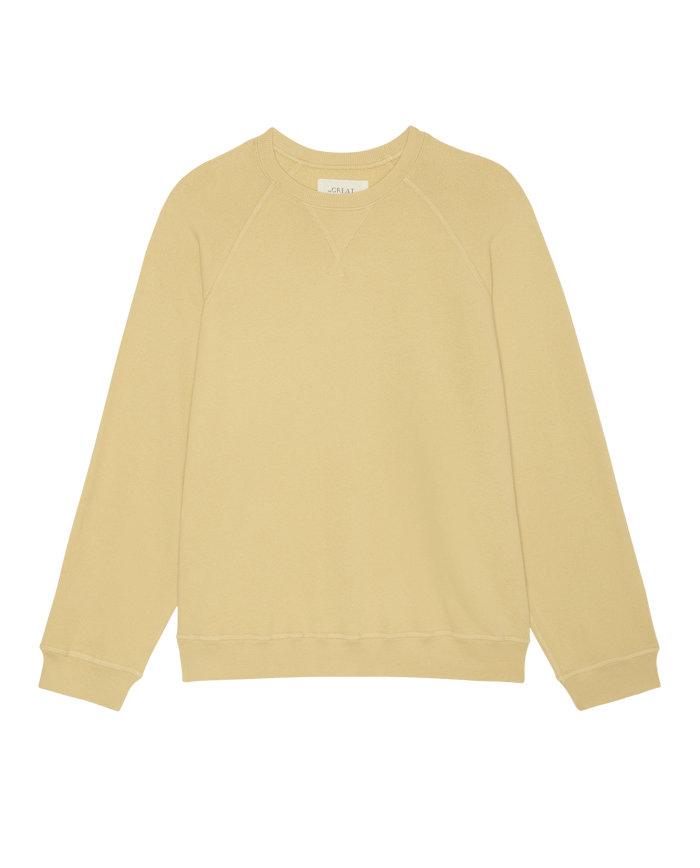 The Slouch Sweatshirt in Butter Yellow by THE GREAT. SP26 SEASONAL CORE features a relaxed, vintage-inspired fit with long sleeves, laid flat on a white background and handcrafted in Los Angeles.