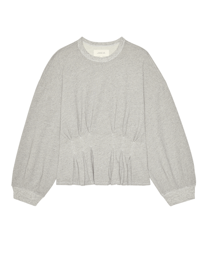 The Slouchy Corset Sweatshirt by THE GREAT. in Varsity Grey features soft French terry, a crewneck, gathered waist, and puffed sleeves—delivering a vintage-inspired look. Styled flat on a white background; from SP26 DANCER BODIES.