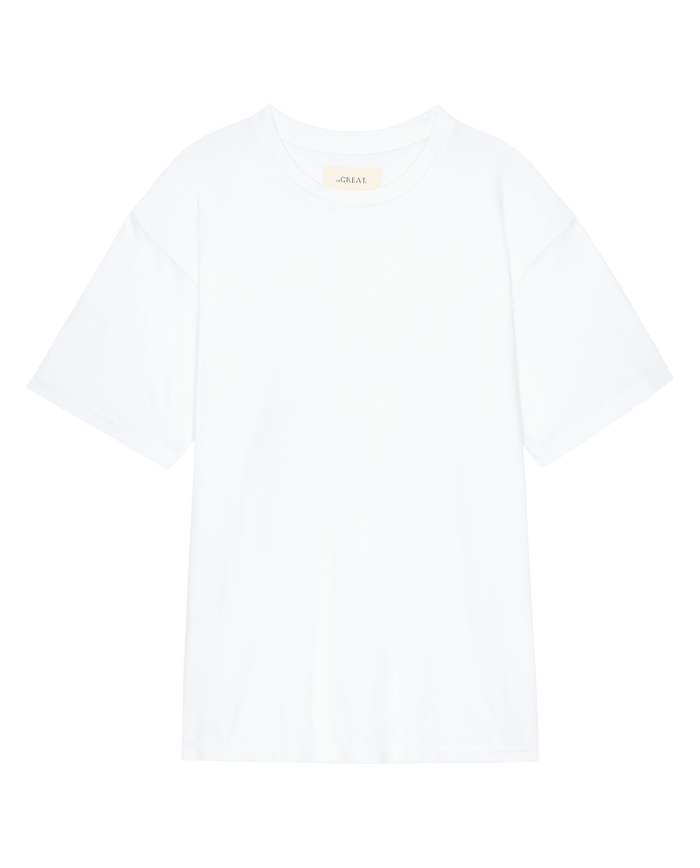 The Slouchy Crew Tee in True White by THE GREAT. SP26 SEASONAL CORE is an oversized fit, short-sleeve crewneck t-shirt shown laid flat on a white background.