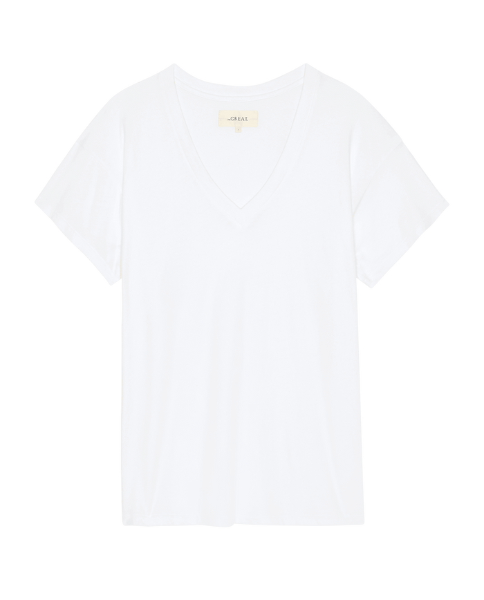 The Slouchy V-Neck Tee in True White by THE GREAT. SP26 SEASONAL CORE features soft washed jersey, a relaxed v-neck, and short sleeves, shown on a white background.