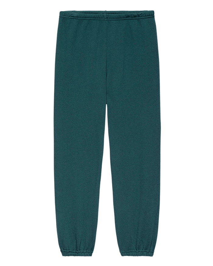 THE GREAT. F26 SEASONAL CORE’s The Stadium Sweatpant. Solid in Dark Slate, featuring an elastic waistband and elastic cuffs inspired by vintage athletic wear and handcrafted in Los Angeles, laid flat on a white background.