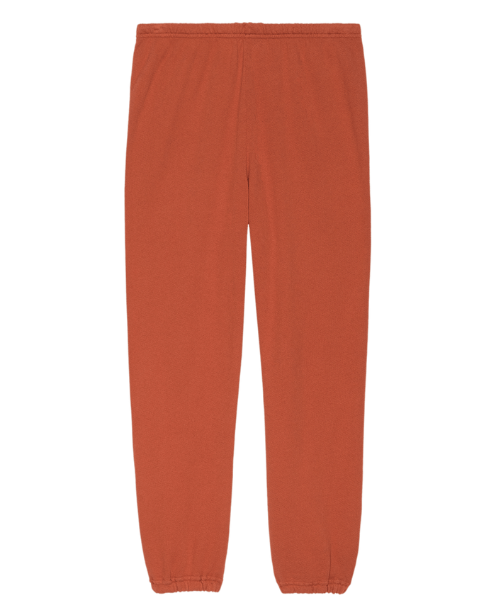 The Stadium Sweatpant. Solid in Desert Clay by THE GREAT. SU25 SEASONAL KNITS, featuring an elastic waistband and cuffs, is shown laid flat on a plain background.