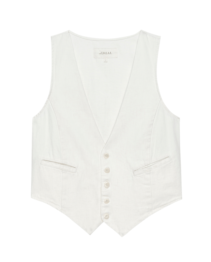 The Suit Vest by THE GREAT. PF24: Natural hemp material in white with a sleeveless design, button closure, and two front pockets, showcased on a plain background.