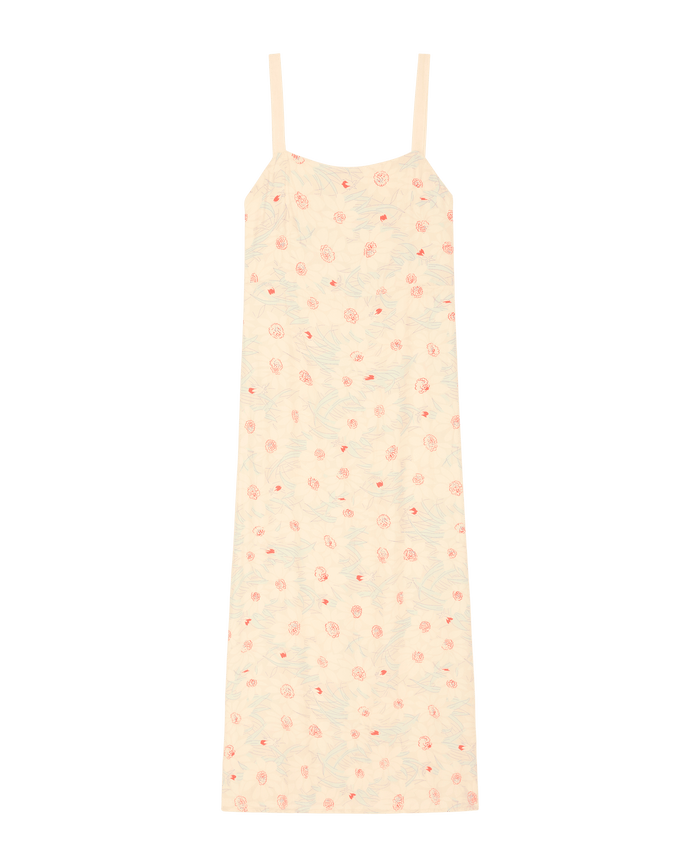 The Sunroom Slip Dress by THE GREAT. SP26 D2, in Champagne Scattered Bloom with thin straps and a pink floral pattern, is displayed on a plain white background.
