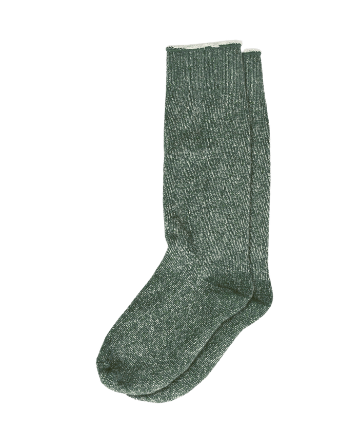 The Sweatshirt Sock in Deep Pine by THE GREAT. CARRYOVER is a pair of green, heathered French Terry socks laid flat on a white background—ideal for cozy comfort in your Fall wardrobe.