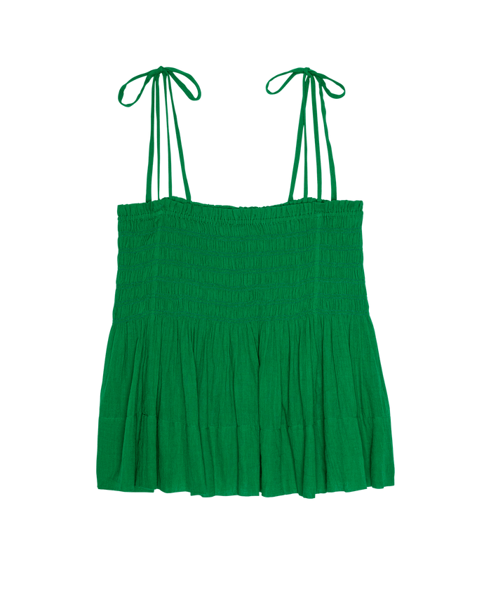 The Tide Smocked Top in Bright Sprig by THE GREAT. SP26 SWIM features a green, sleeveless design with gathered fabric, adjustable tie straps, and a fitted bodice, shown on a plain white background.