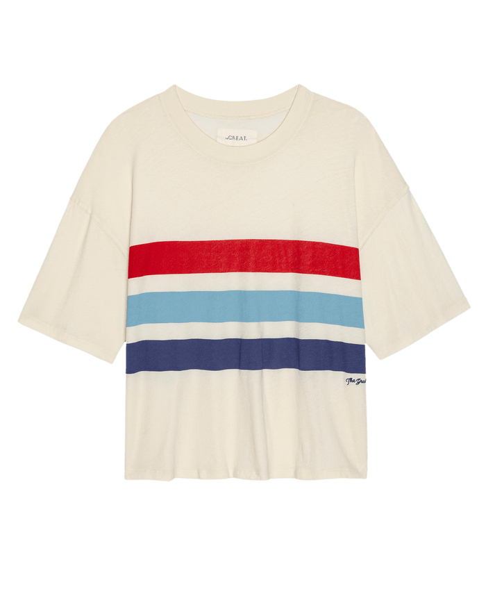 THE GREAT. SU26’s Track Crew W/ Saltwater Stripe in Washed White is a short-sleeved tee with red, light blue, and dark blue stripes across the chest—ideal for achieving that relaxed track crew look.