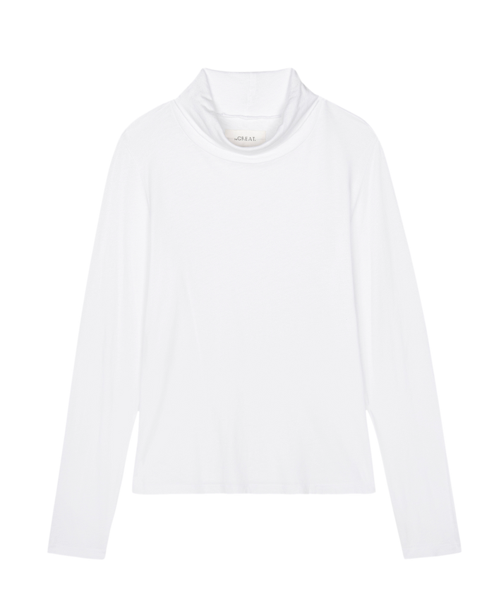 From THE GREAT. HOL 24 TURTLENECKS collection, The Turtleneck in True White showcases its timeless long-sleeve design gracefully against a plain backdrop.