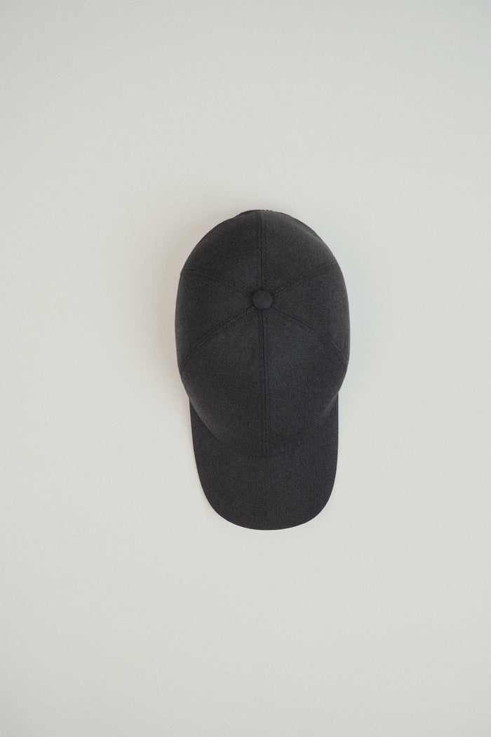 grey baseball cap on a light gray background