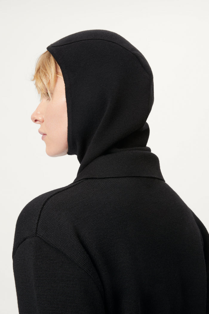 woman wearing a black ultrasoft miniclava against a white background