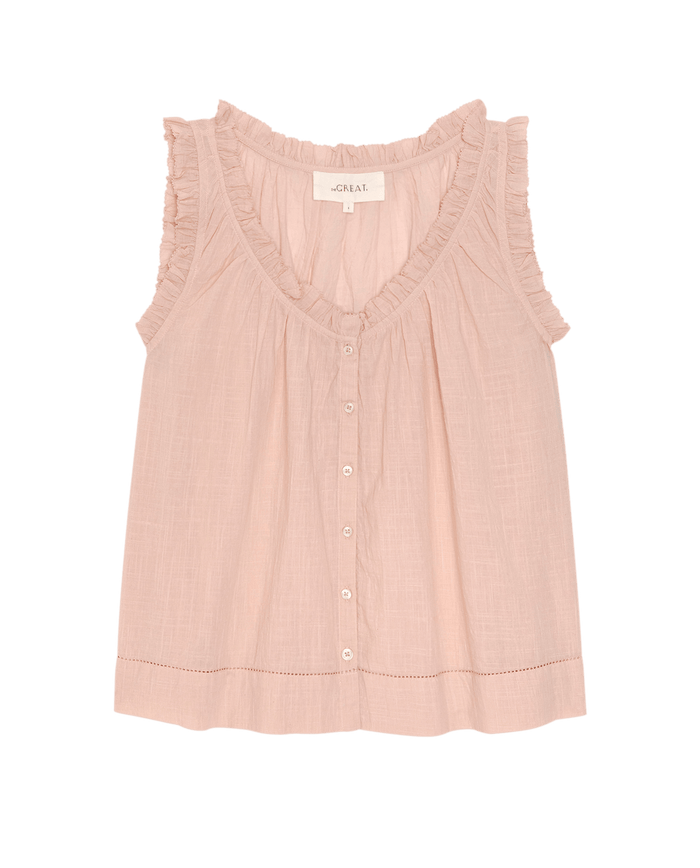 The Vignette Top in Petal by THE GREAT. SU26 is a sleeveless blouse featuring a ruffled V-neckline and button-down front, shown flat on a white background.